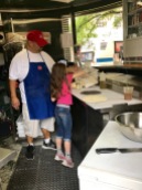 Mario showing my friend Lucy's daughter how to make pizza